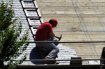 Man installing roofing