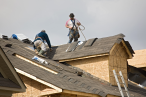 Two men working on roof